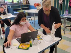 Teacher working with a student Teacher working with a student