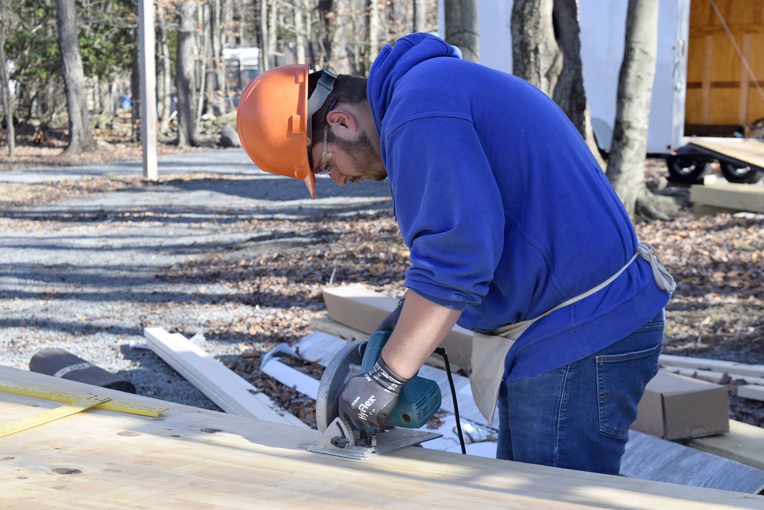 CTE Construction program student using a circular saw